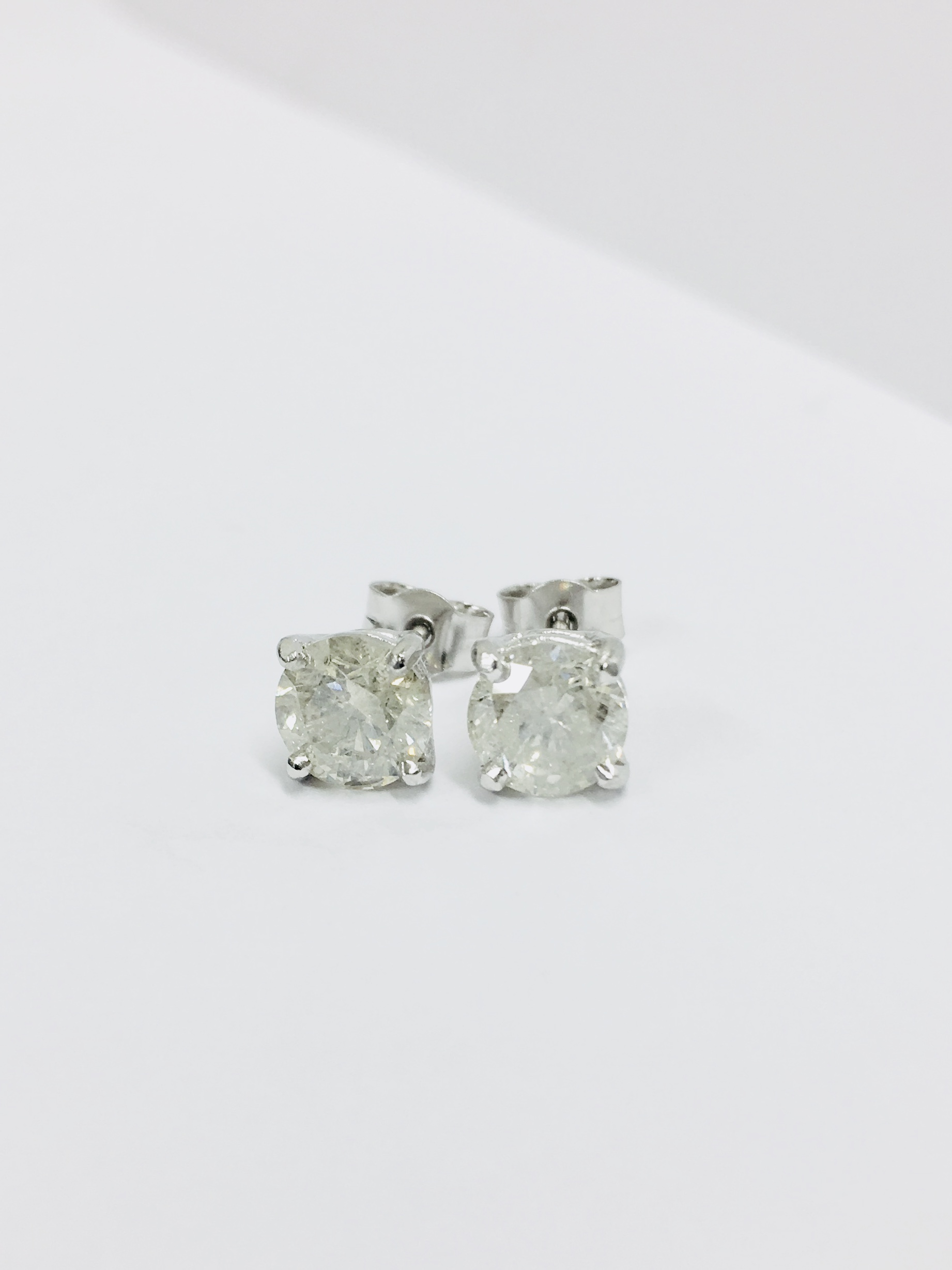2.00ct Solitaire diamond stud earrings set with brilliant cut diamonds which have been enhanced. I - Image 2 of 3