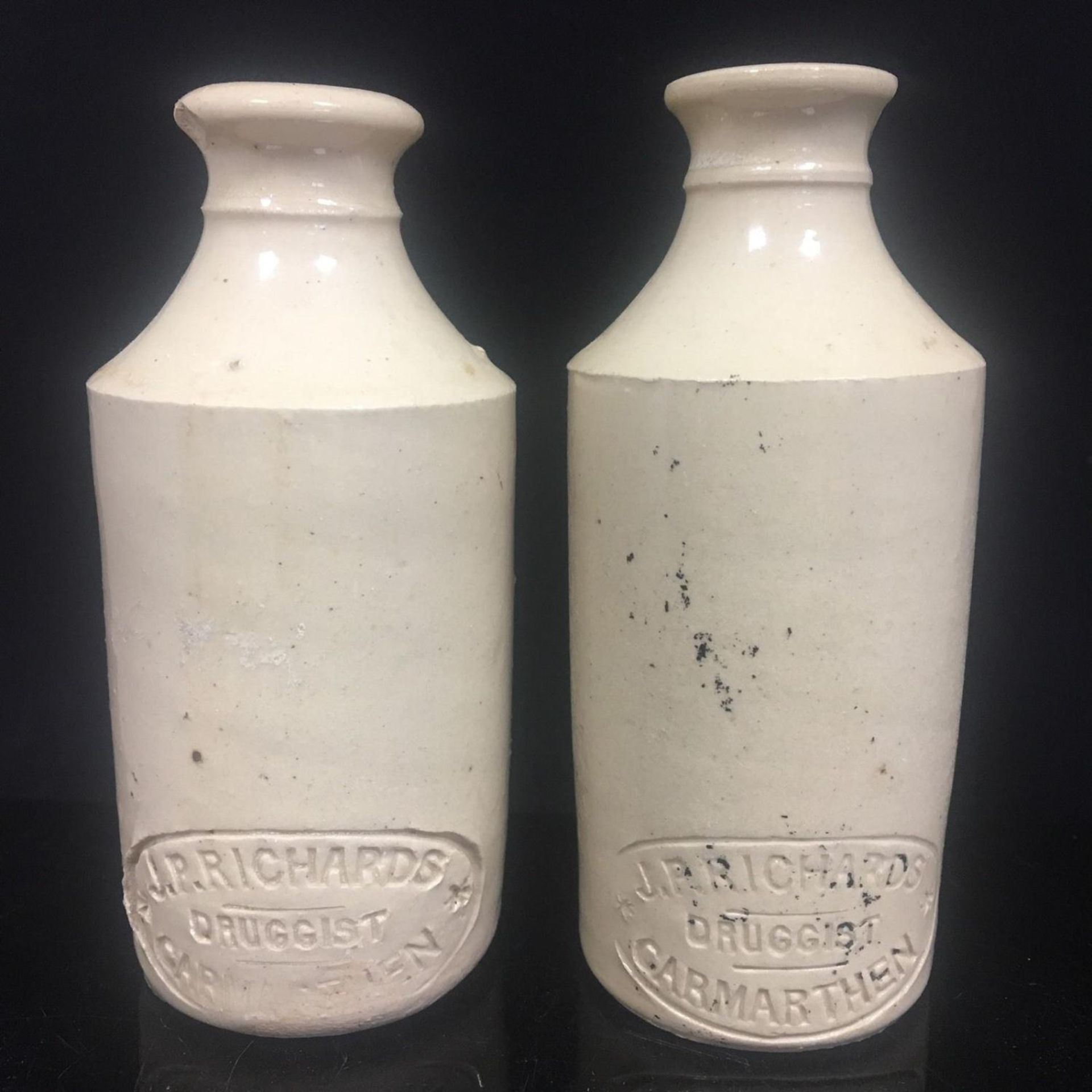 Pair antique Welsh stoneware chemist bottles - J P Richards Druggist Carmarthen