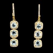 An Exquisite Pair Of Earrings Set With 6 Natural Blue Topaz Gemstones - Clarity If