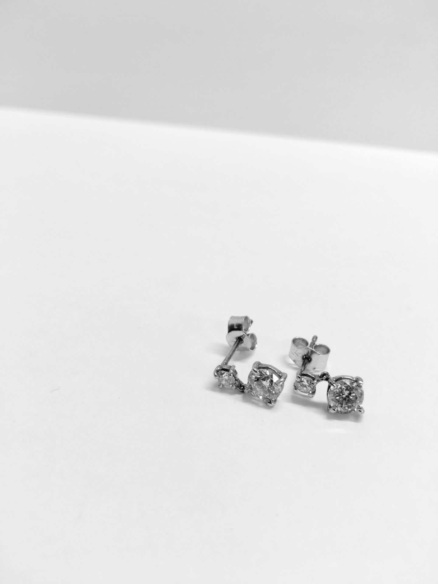 18ct white gold drop style earrings. Each has 2 brilliant cut diamonds, I colour, si3 clarity. Total - Image 2 of 3