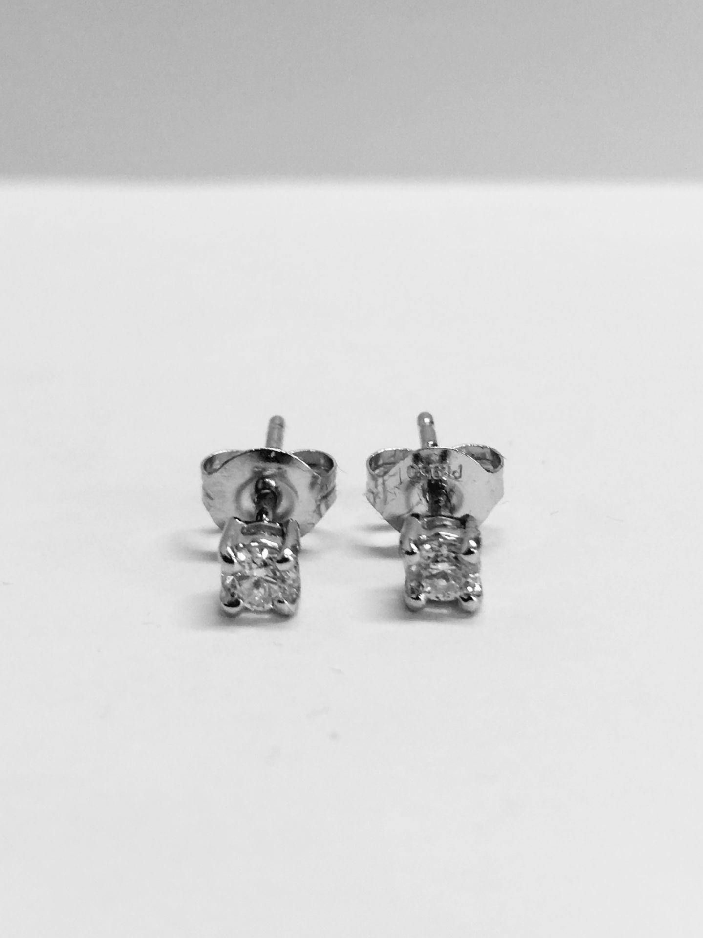 0.30ct diamond solitaire stud earrings set in platinum 950. Brilliant cut diamonds I colour, si2
