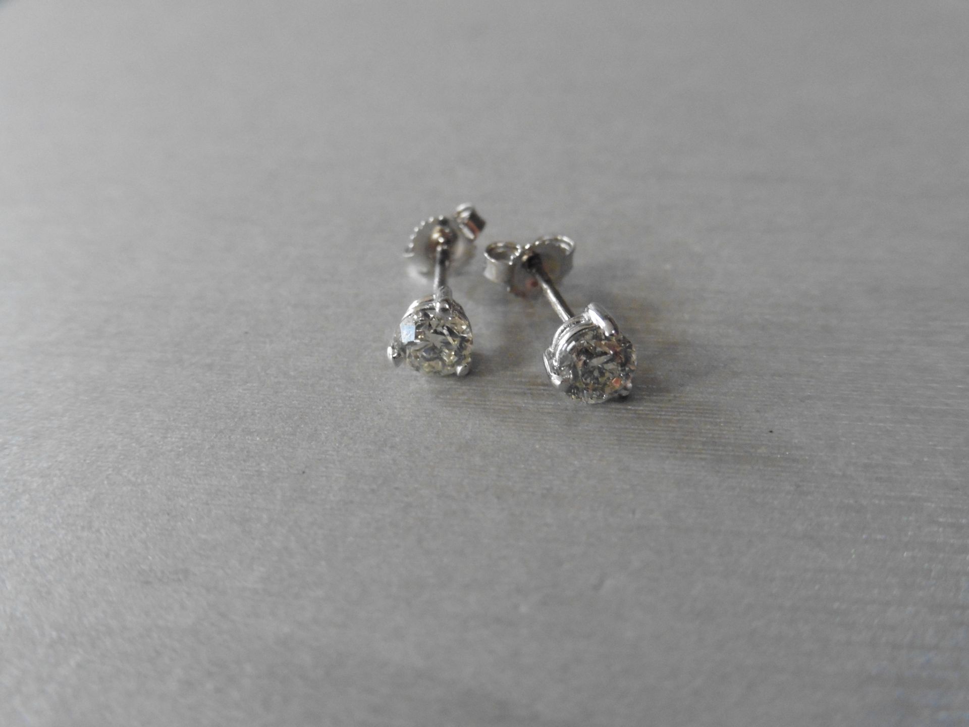 1.00ct Solitaire diamond stud earrings set with brilliant cut diamonds, i1 clarity and I colour. Set