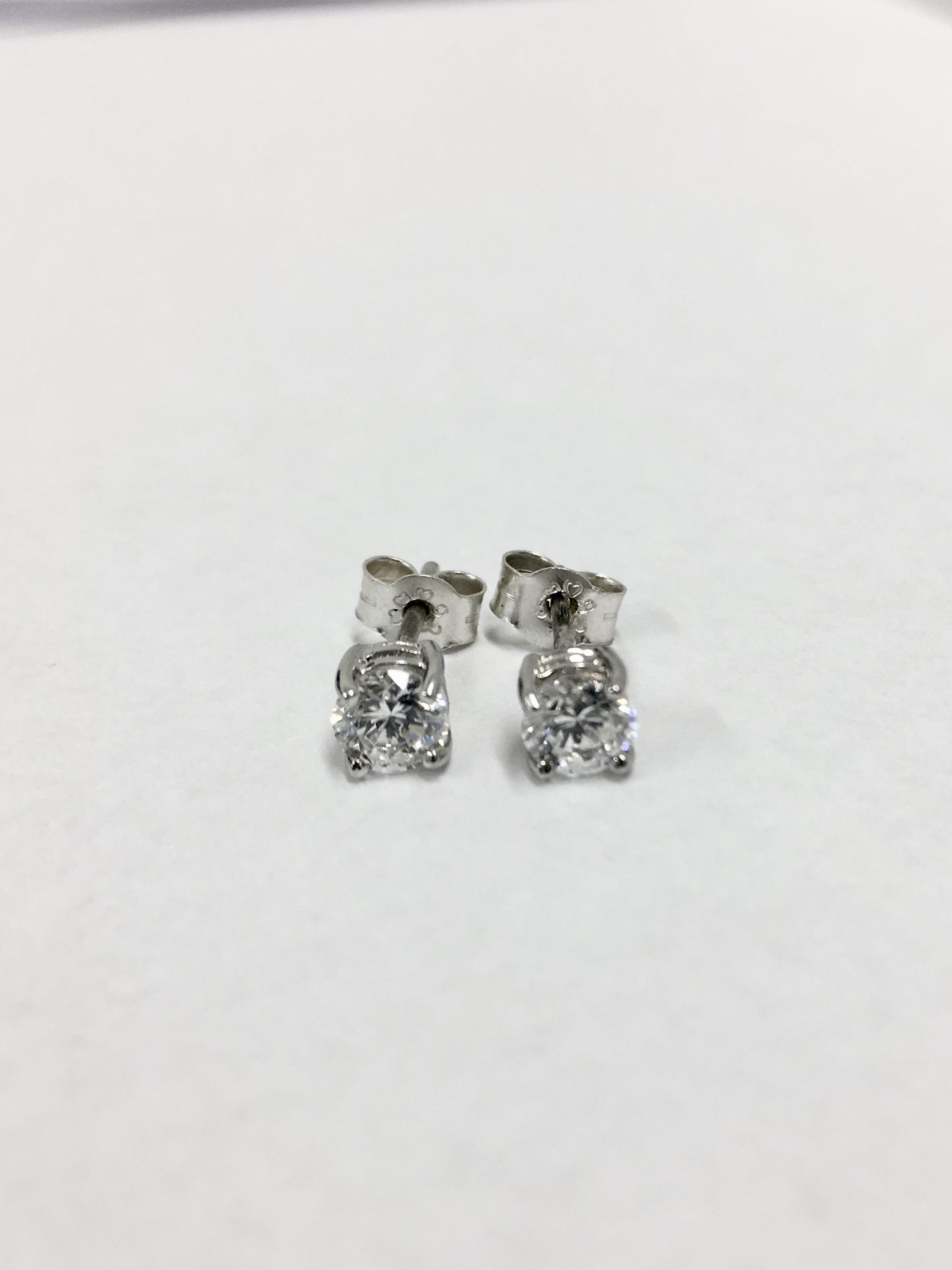 0.80ct Solitaire diamond stud earrings set with brilliant cut diamonds, SI2 clarity and I colour.