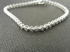 0.25ct illusion set diamond bracelet set in 9ct white gold. Small brilliant cut diamonds, H colour