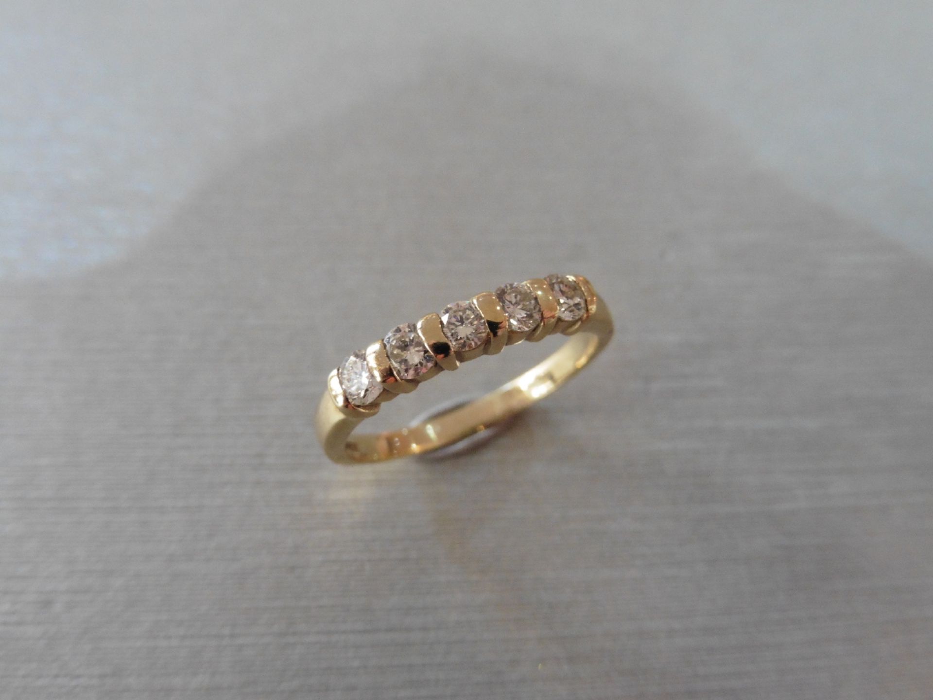 0.50ct diamond five stone ring set in 9ct yellow gold. Brilliant cut diamonds, I colour and si2