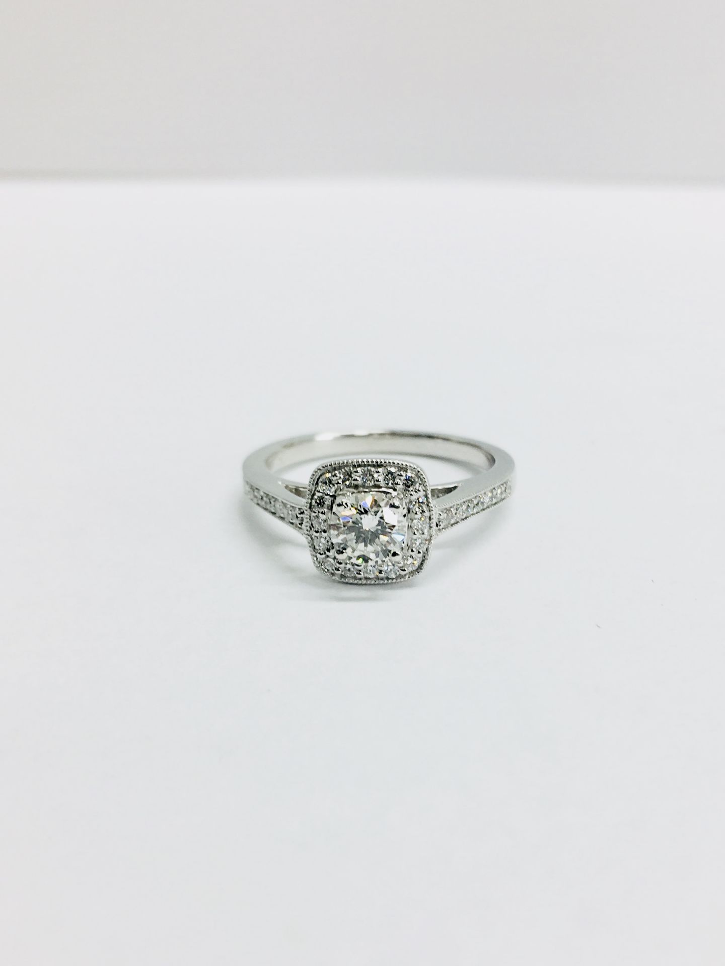 9ct white gold Diamond Halo solitaire ring,0.30ct centre h colour is grade,0.18ct h colour is