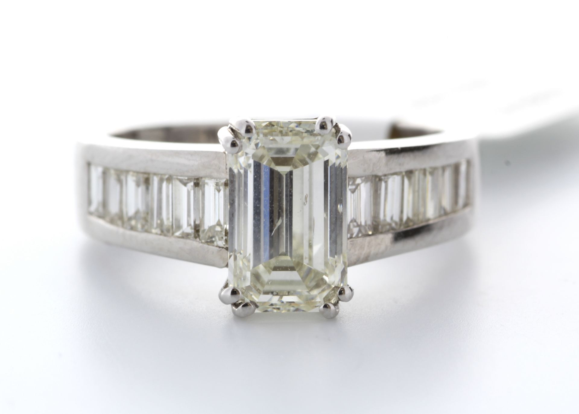 18ct White Gold Single Stone Claw Set Emerald Cut With Stone Set Shoulders Diamond Ring 2.90