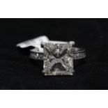 18ct White Gold Single Stone, Princess Cut With Stone Set Shoulders Diamond Ring 7.01 Carats