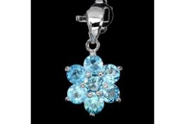A Beautiful natural Swiss Blue Topaz Pendant - set with 7 Natural African Blue Topaz