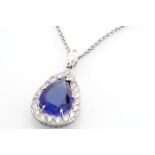 18ct White Gold Tanzanite And Diamond Halo Pendant 2ct Diamonds - 9ct Tanzanite