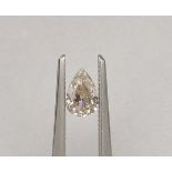 An unmounted Pear-shaped diamond weighing app. 0.59ct. Colour : Brown .Clarity :SI2