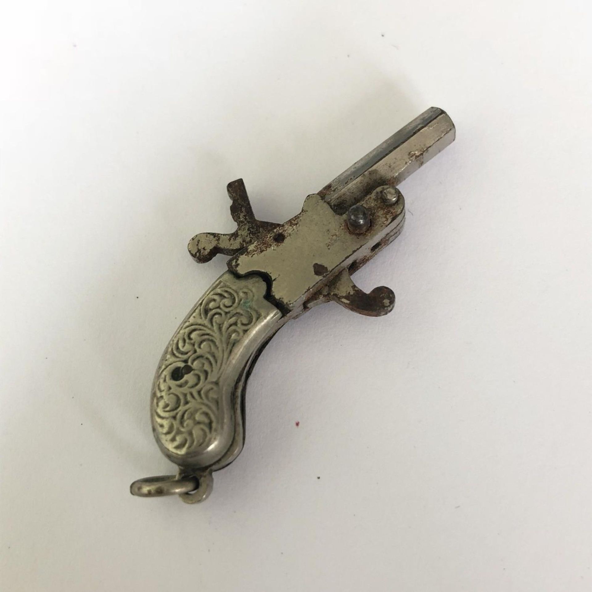 A Miniature Antique Tiny Spy Pistol - Berloque 2mm Pin Fire Gun with Scroll Grip - Image 3 of 3