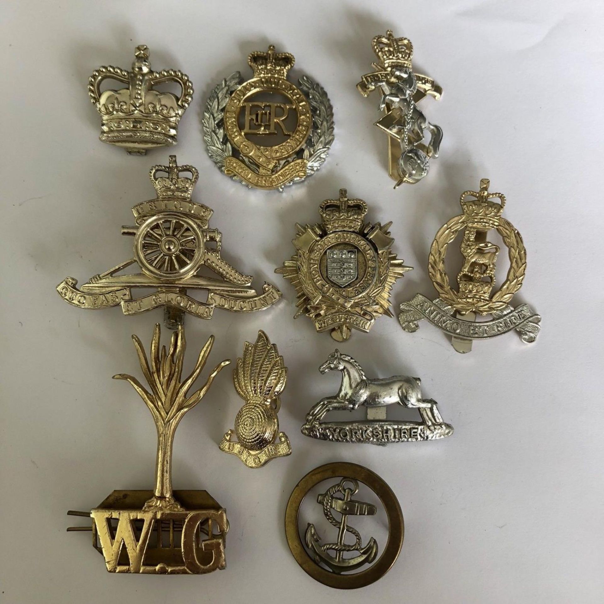 Group of 10 British military cap badges