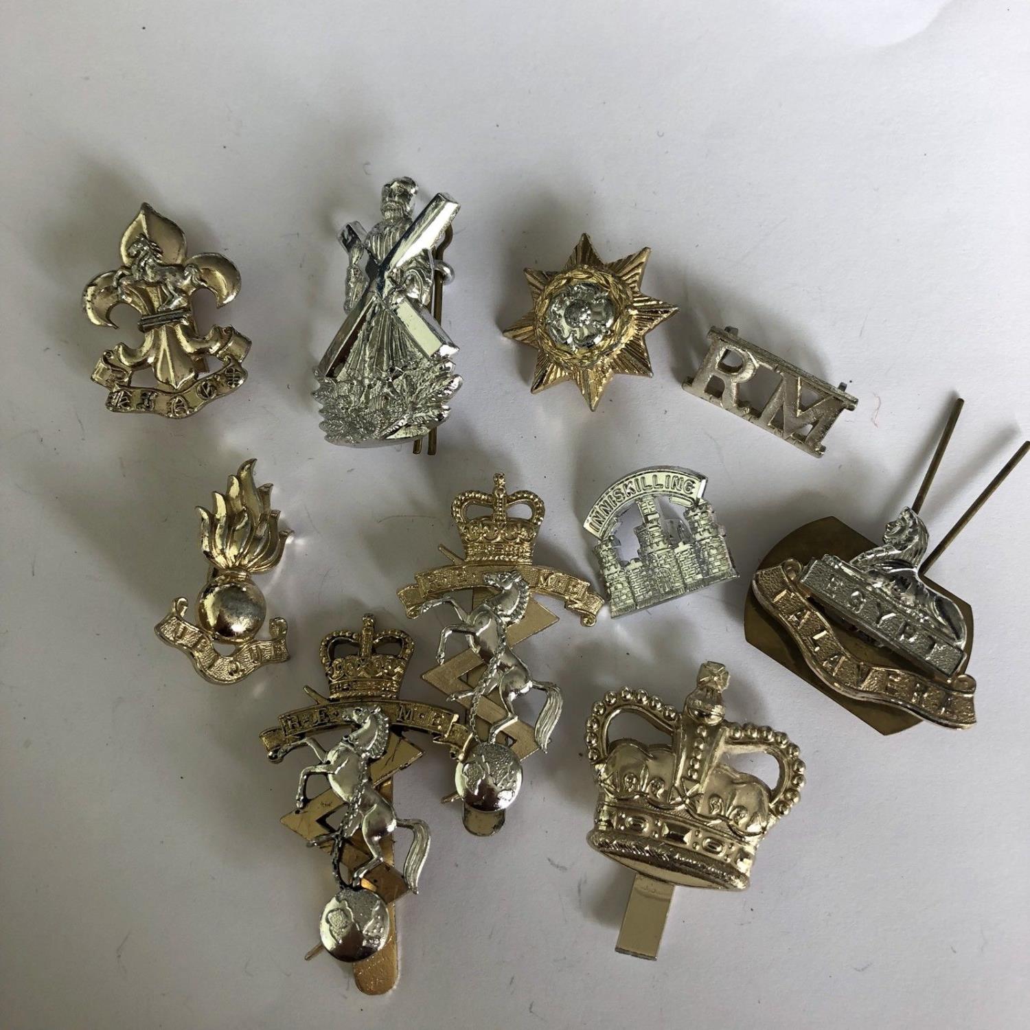 Group of 10 British military cap badges