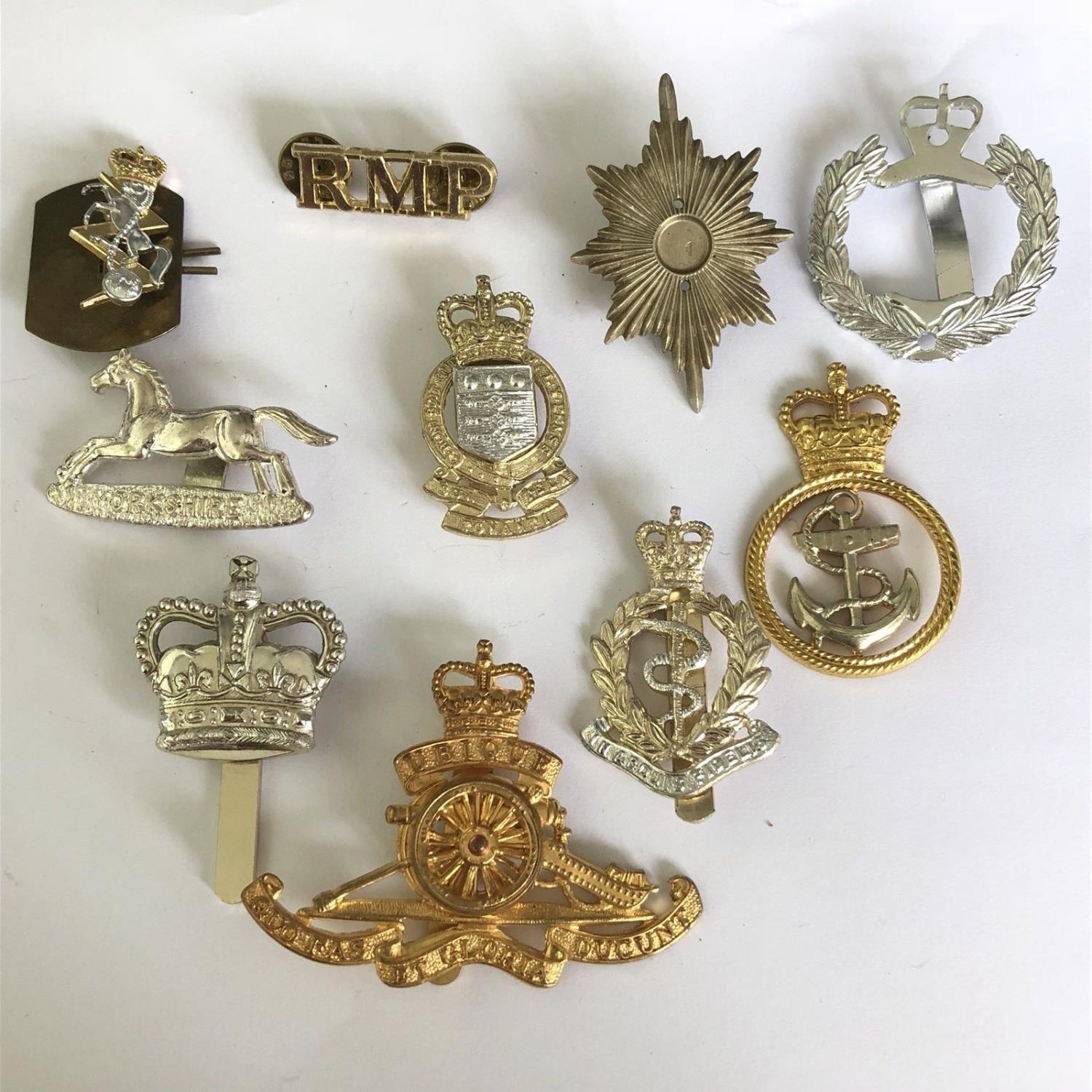 Group of 10 British military cap badges