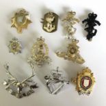 Group of 10 British military cap badges