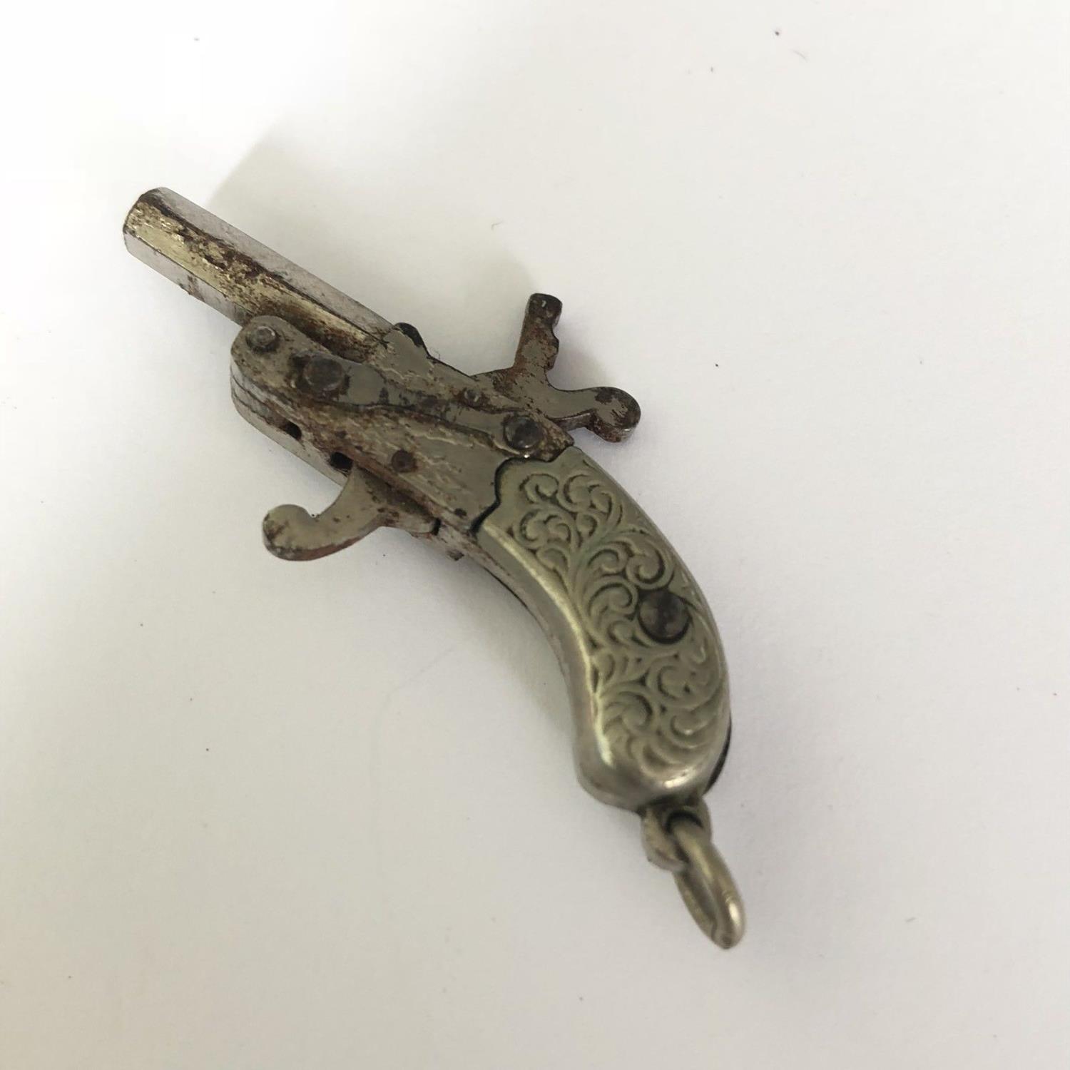 A Miniature Antique Tiny Spy Pistol - Berloque 2mm Pin Fire Gun with Scroll Grip - Image 2 of 3
