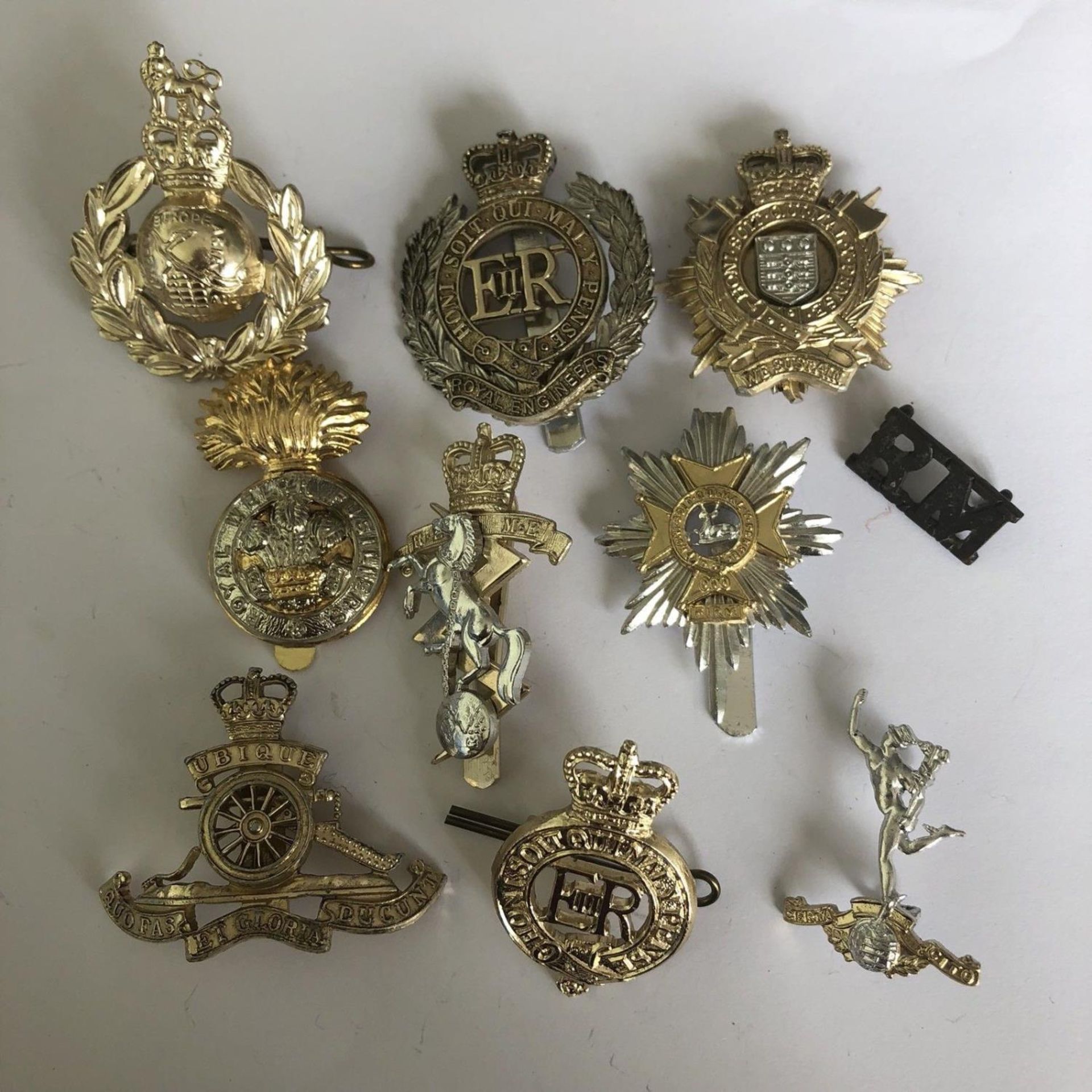 Group of 10 British military cap badges