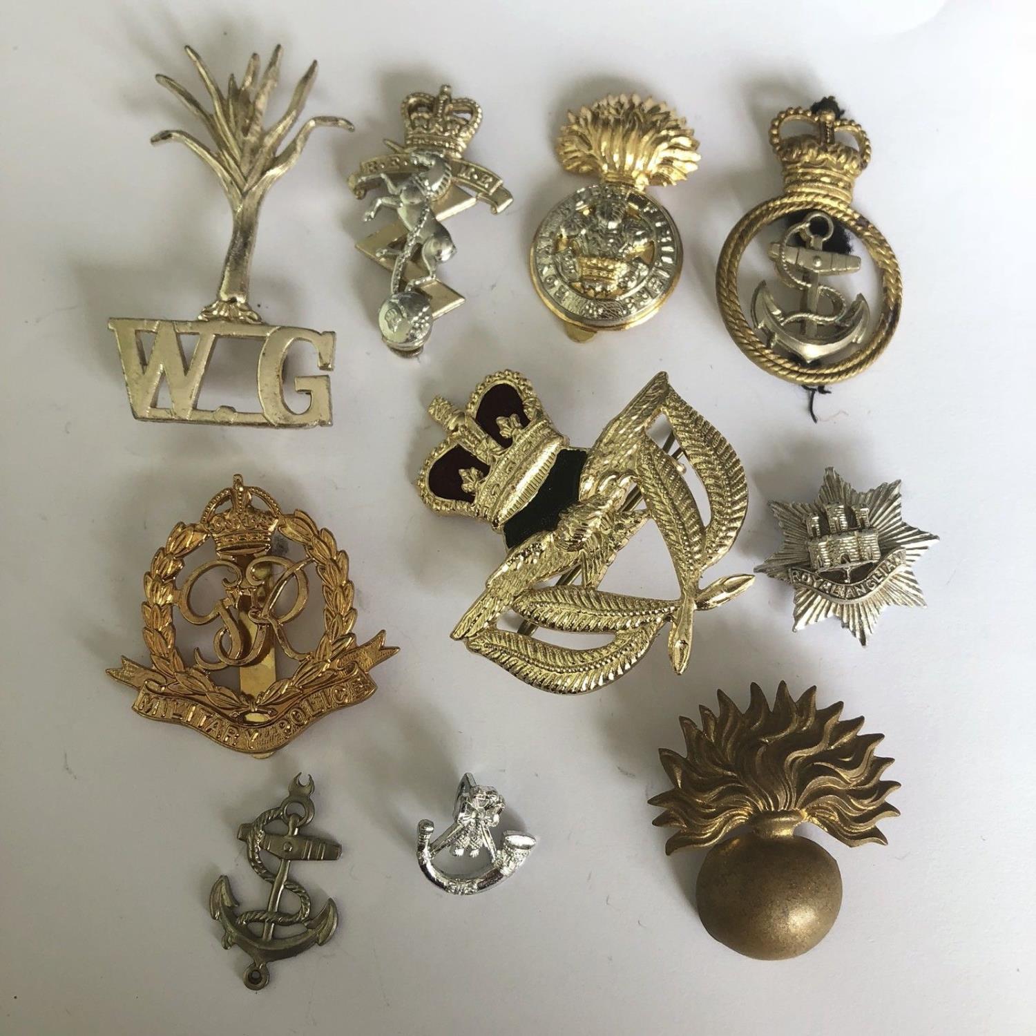 Group of 10 British military cap badges