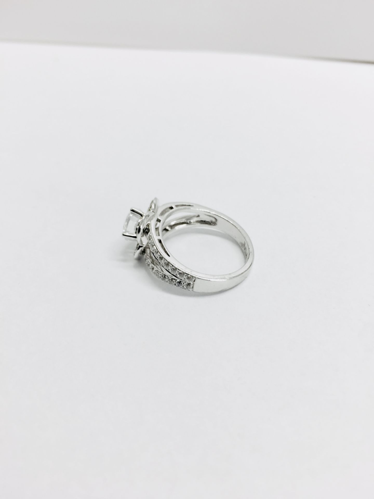 1.04ct diamond set soliatire ring in platinum. H colour and I1 clarity. Halo setting small