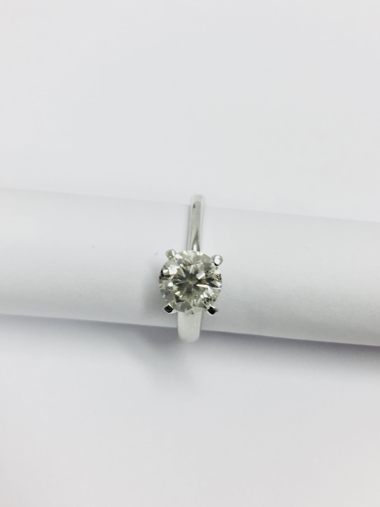 1.02 ct diamond twist solitaire ring set in platinum. 6 claw setting. Enhanced brilliant cut