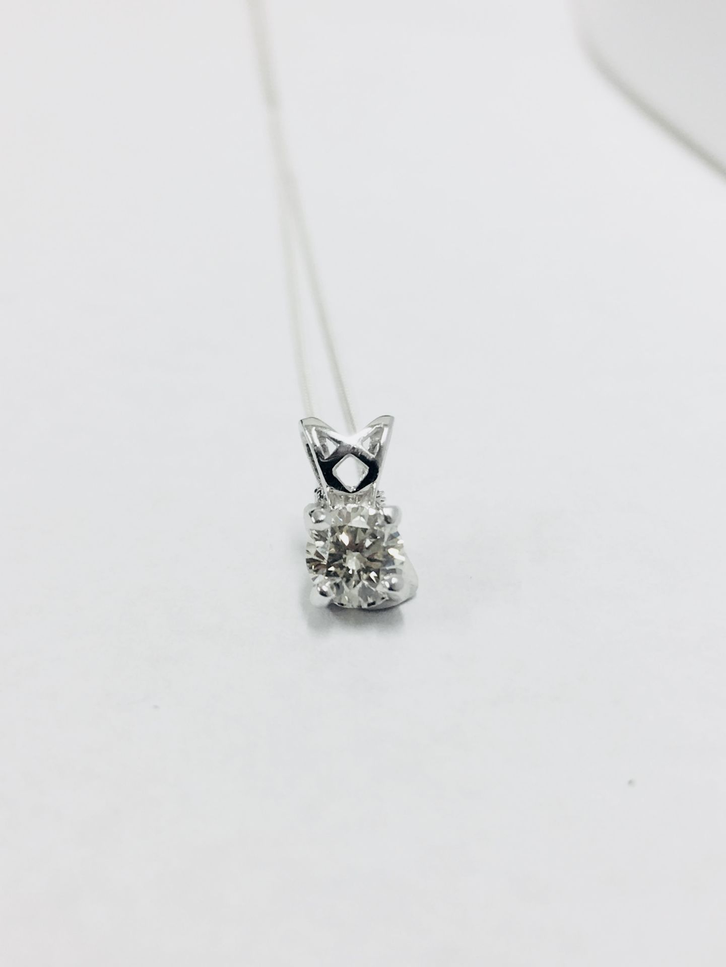 1.00ct diamond pendant set in platinum. H colour and I1 clarity. 4 claw setting with open bale and