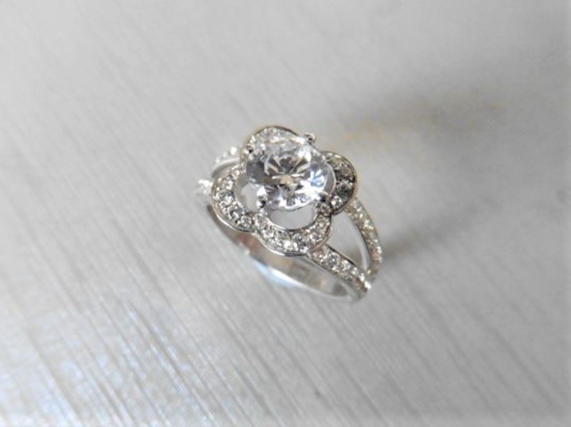 0.50ct diamond set solitaire ring set in platinum. Mount is diamond set with 0.64ct of small
