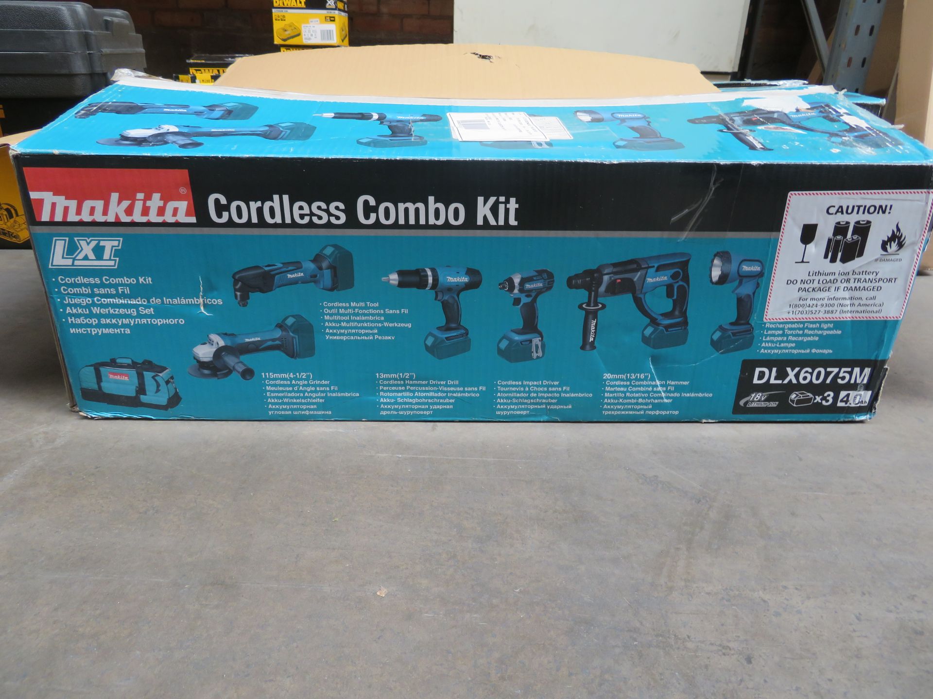 (A8) Makita Dlx6075M 18V 4.0Ah Li-Ion Lxt Cordless 7 Piece Kit - New Condition, Slightly Worn Box.