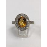 18ct yellow gold citrine & diamond oval cluster ring