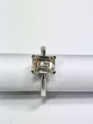 2ct diamond solitaire ring set with an emerald cut diamond, N ( light brown ) colour and VS1
