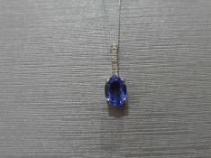 0.80ct tanzanite and diamond drop style pendant. 7X 5mm oval tanzanite set with 5 small brilliant