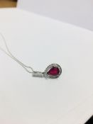 18ct white gold ruby and diamond pendant,1ct pearshape ruby (treated),23 diamonds g Coloured vs