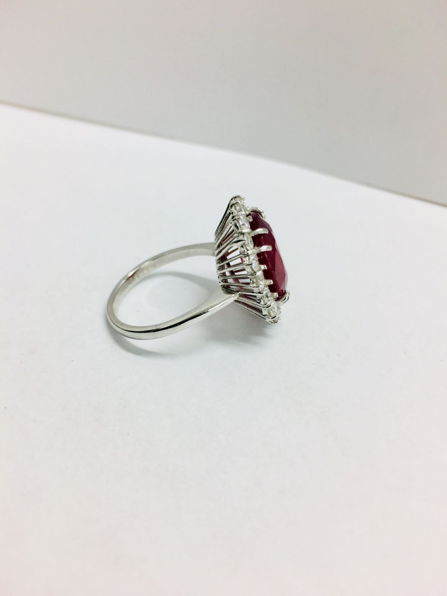 6ct ruby and diamond cluster ring set in platinum. Oval cut colour treated ( fracture filled ) - Image 3 of 6