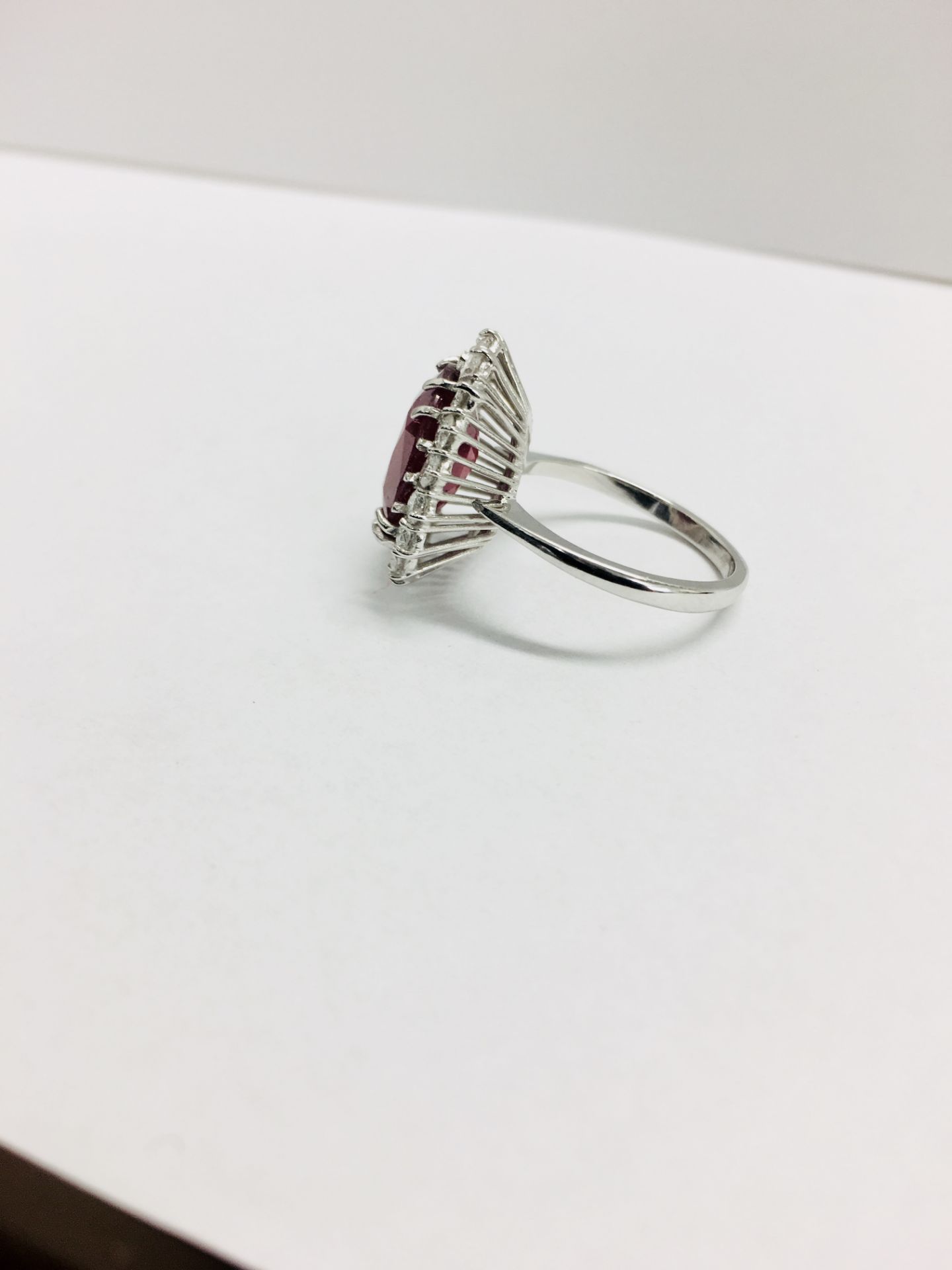 6ct ruby and diamond cluster ring set in platinum. Oval cut colour treated ( fracture filled ) - Image 6 of 6