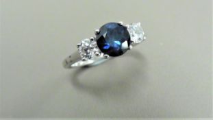 Sapphire and diamond trilogy ring. 5mm round cut sapphire ( treated ) with a brilliant cut diamond