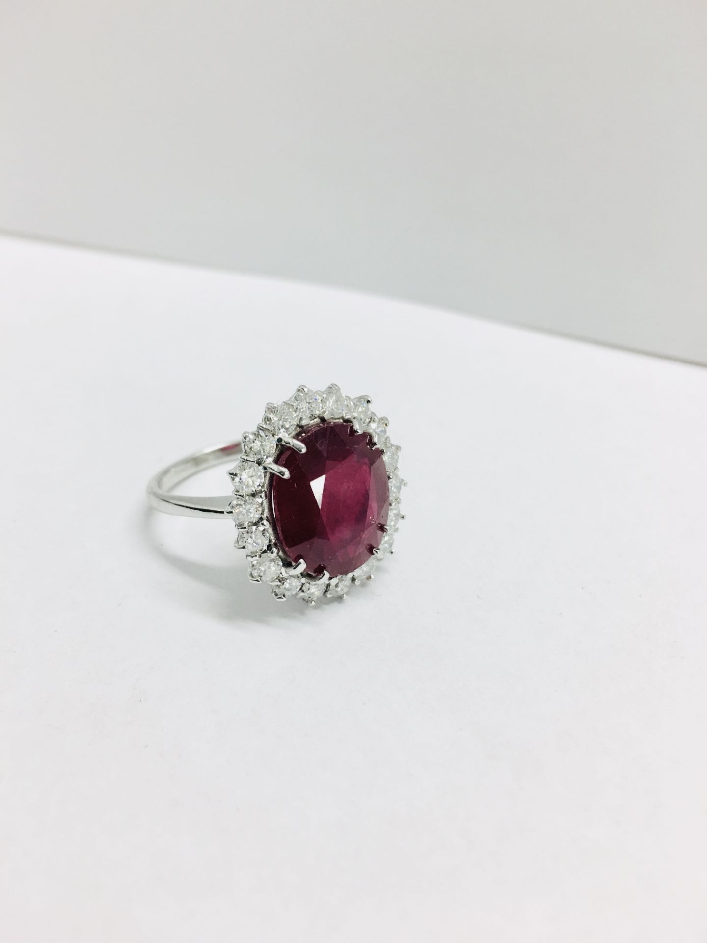 6ct ruby and diamond cluster ring set in platinum. Oval cut colour treated ( fracture filled ) - Image 2 of 6