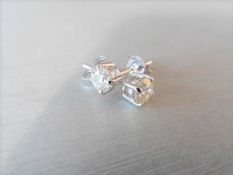1.90ct Diamond solitaire earrings set with brilliant cut diamonds, I colour I1 clarity. Four claw