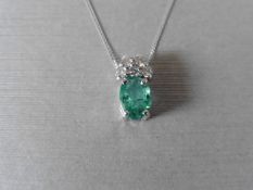 Emerald and Diamond set pendant,1 x oval cut Emerald 8 x 6mm ( treatment unknown for this stone)1.