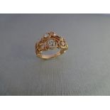 14ct rose gold open diamond dress ring. Set with graduated Brilliant cut diamonds, of H colour and