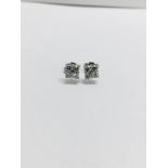 0.80ct dimond cluster style stud earrings. Each set with 4 small brillint cut diamonds, I colour and