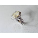 2.01ct fancy yellow oval diamond,si clarity very good cut,platinum handmade string 5.gms,diamond set