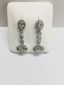 18ct white gold fantasy drop earrings ,6 oval diamonds total weight 0.78ct,6 pearshape diamonds 1.