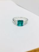 18ct Emerald and diamond three stone,gem quality natural Emerald 1.45ct,0.69ct trillion cut vs