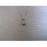 0.10ct diamond solitaire pendant set in 18ct gold. 4 claw setting, plain bale. I colour and si3