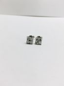 0.50ct diamond cluster style stud earrings. Each set with 4 small brillint cut diamonds, I colour