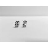 0.20ct Solitaire diamond stud earrings set with brilliant cut diamonds, i1 clarity and I colour. Set