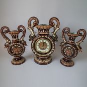 Majolica clock garnature of dolphin handled clock & vases