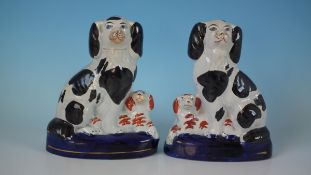 Pair Staffordshire Pottery spaniel&pups on cobalt bases