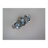 An Unused 3 Stone Aquamarine and Diamond Ring