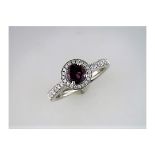 An Unused Diamond and Rhodolite Halo Ring